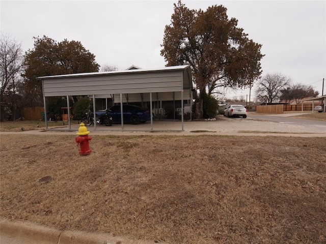 view of front of home featuring a carport