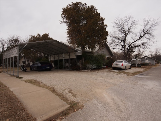 view of vehicle parking featuring a carport