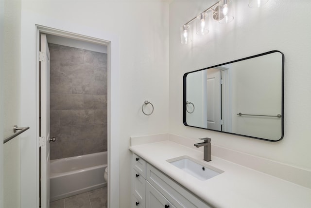 bathroom featuring tub / shower combination, vanity, toilet, and tile patterned floors