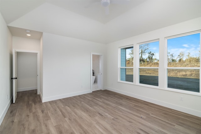 unfurnished bedroom featuring light wood finished floors, ceiling fan, and baseboards