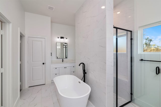 full bathroom featuring marble finish floor, a soaking tub, visible vents, a stall shower, and vanity