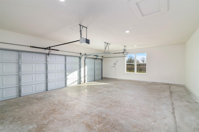 garage with baseboards and a garage door opener