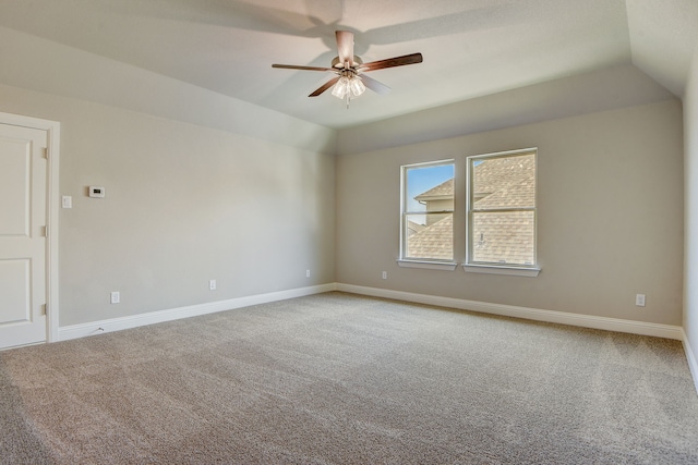 carpeted empty room with lofted ceiling and ceiling fan