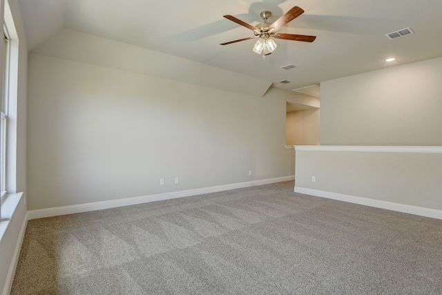 carpeted empty room featuring ceiling fan