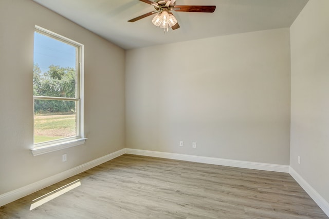 unfurnished room with light hardwood / wood-style flooring and ceiling fan