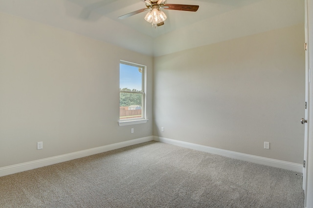 unfurnished room with lofted ceiling, ceiling fan, and carpet flooring