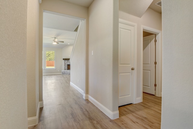 corridor featuring light wood-type flooring