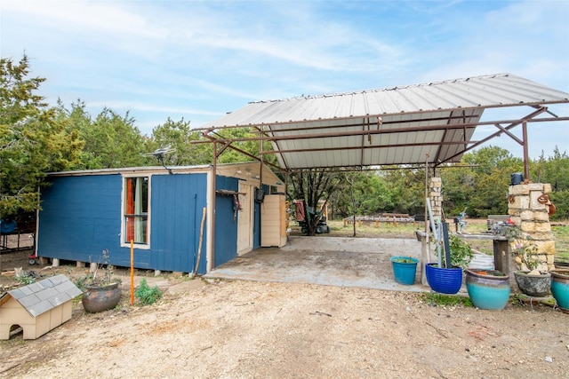 exterior space with a carport