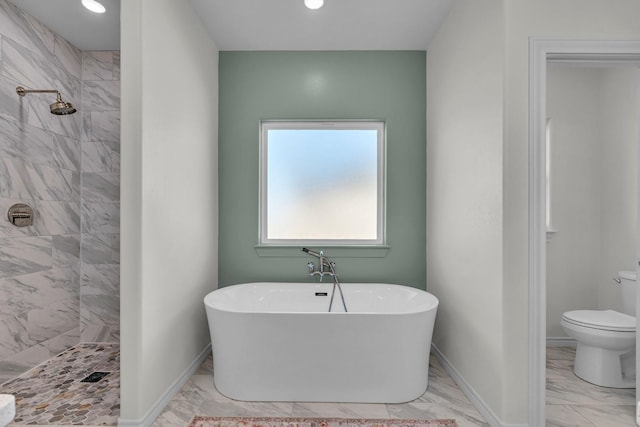 227 Rio Grande, Abilene, TX 79606 - full bathroom featuring marble look tile flooring, a freestanding tub, a tile shower, and recessed lighting
