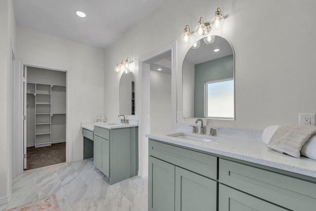 227 Rio Grande, Abilene, TX 79606 - full bathroom with two vanities, a spacious closet, marble finish floors, and recessed lighting