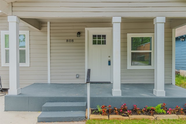 entrance to property with covered porch