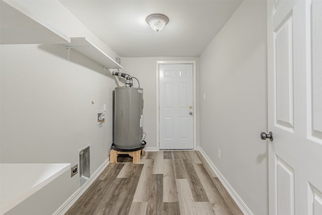 washroom featuring water heater, electric dryer hookup, washer hookup, and light hardwood / wood-style floors