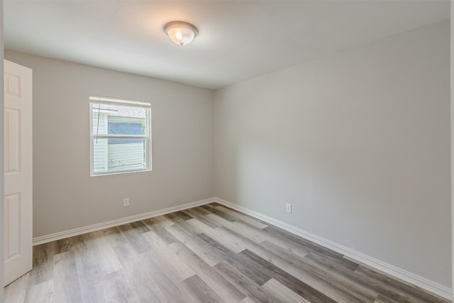 spare room with light wood-type flooring