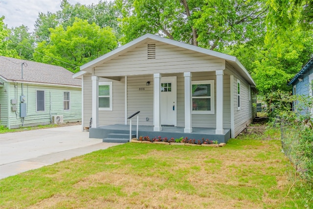 bungalow-style home featuring a porch and a front yard