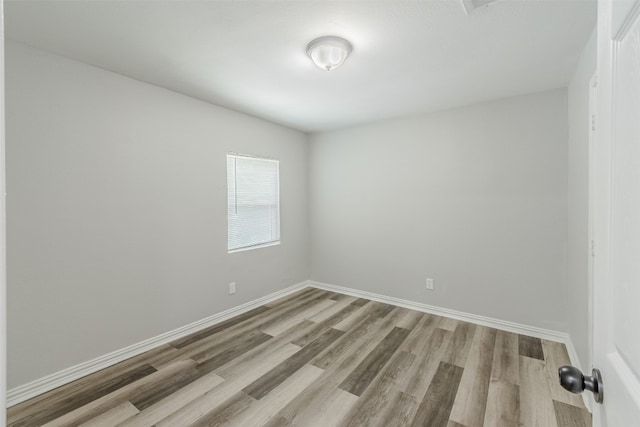 spare room featuring light hardwood / wood-style floors