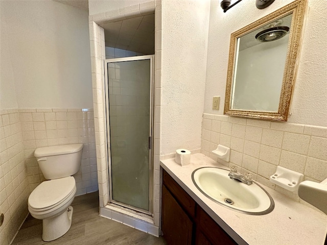 bathroom featuring tile walls, tasteful backsplash, toilet, and oversized vanity