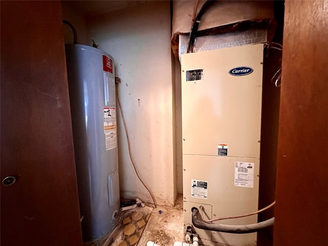 utility room featuring heating utilities and water heater