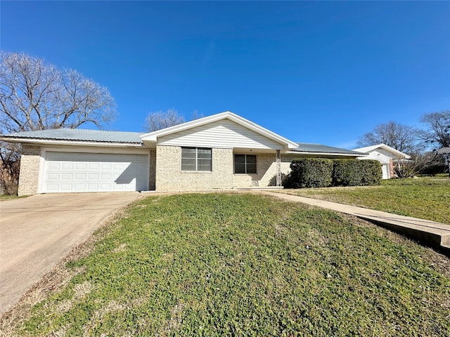 ranch-style home with a front lawn and a garage