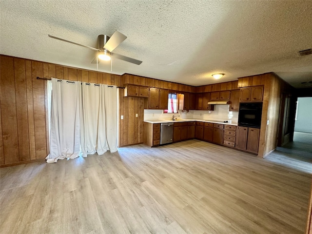 kitchen featuring a textured ceiling, light wood-type flooring, ceiling fan, and black appliances