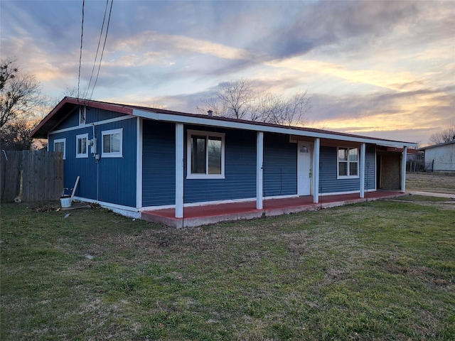 view of front of house featuring a porch and a lawn