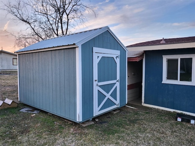 view of outdoor structure at dusk