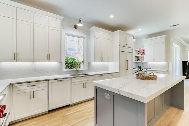 kitchen featuring white cabinetry and paneled built in fridge