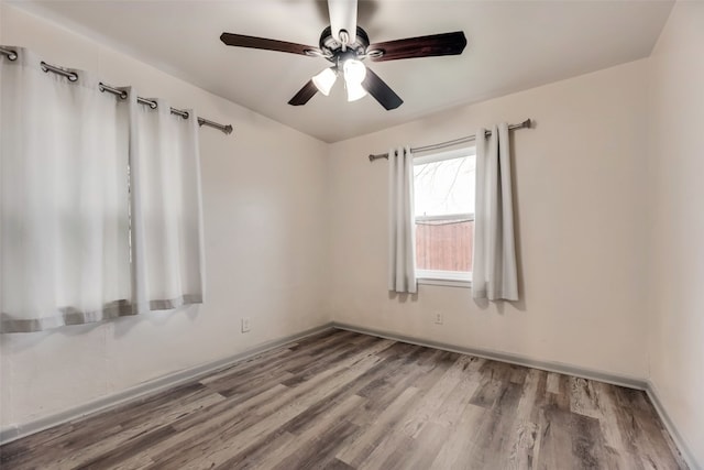 spare room featuring ceiling fan and hardwood / wood-style floors