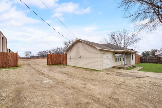 view of side of home featuring a yard