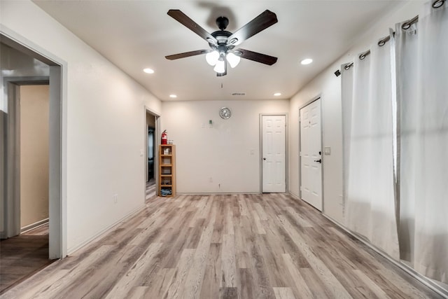 interior space featuring light hardwood / wood-style floors and ceiling fan