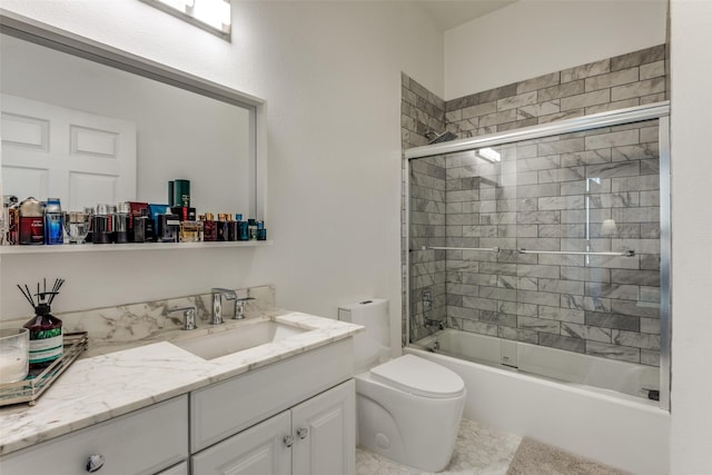 full bathroom with vanity, enclosed tub / shower combo, and toilet