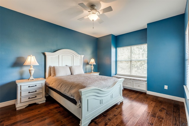 bedroom with ceiling fan and dark hardwood / wood-style flooring