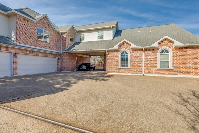 townhome / multi-family property featuring a garage