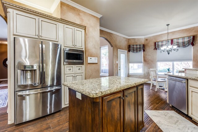 kitchen featuring light brown cabinets, stainless steel refrigerator, light stone counters, and beverage cooler