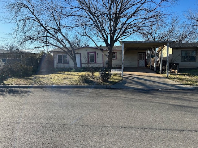 view of front of property featuring a carport