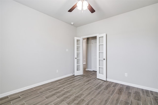 unfurnished bedroom with ceiling fan, hardwood / wood-style floors, and french doors