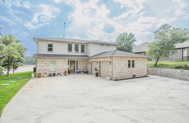 back of house with a lawn