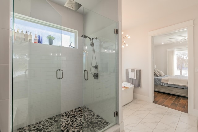 bathroom with an enclosed shower and tile flooring