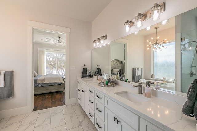 bathroom with oversized vanity, dual sinks, a chandelier, and tile flooring