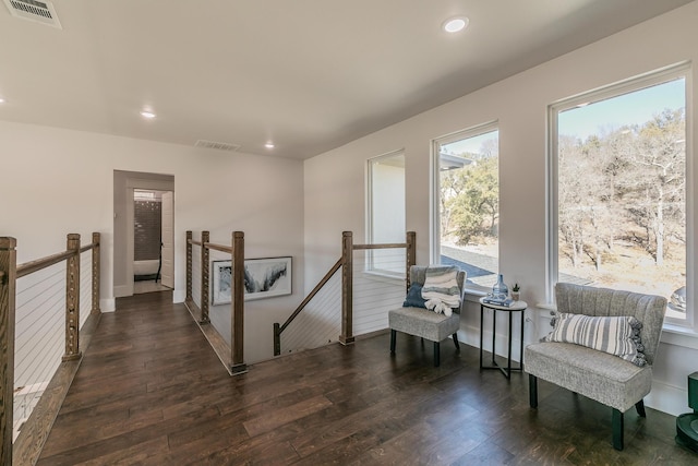 sitting room featuring dark hardwood / wood-style flooring