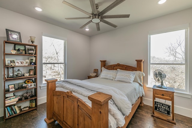 bedroom featuring ceiling fan and dark hardwood / wood-style floors