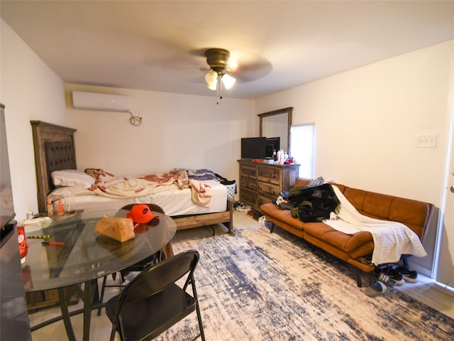 bedroom featuring a wall mounted air conditioner and ceiling fan