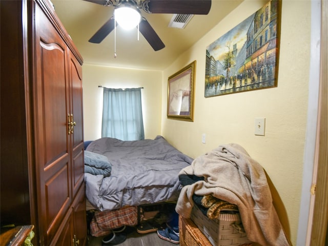 bedroom with hardwood / wood-style floors and ceiling fan