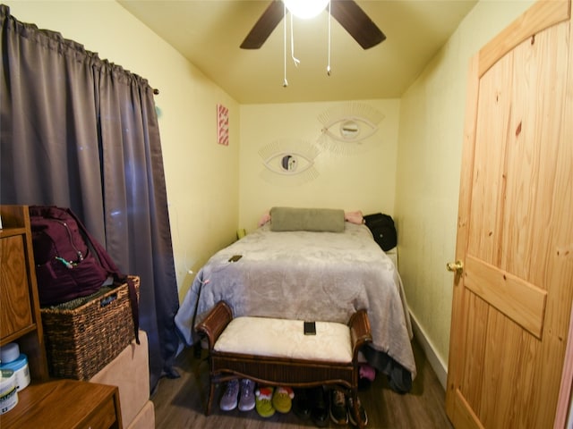 bedroom featuring ceiling fan and dark hardwood / wood-style flooring