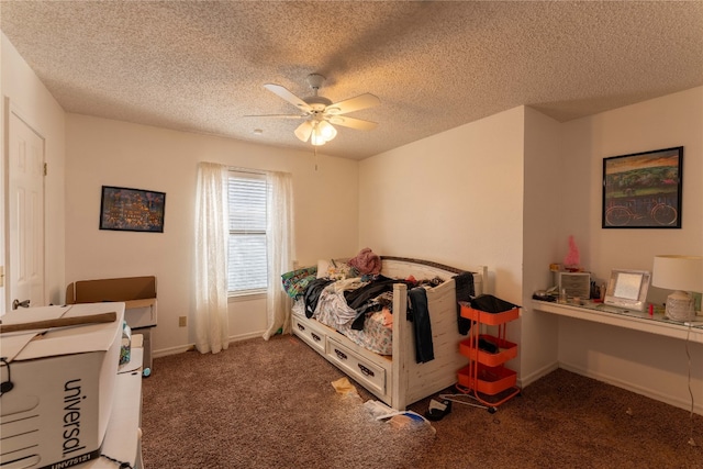 carpeted bedroom with ceiling fan and a textured ceiling