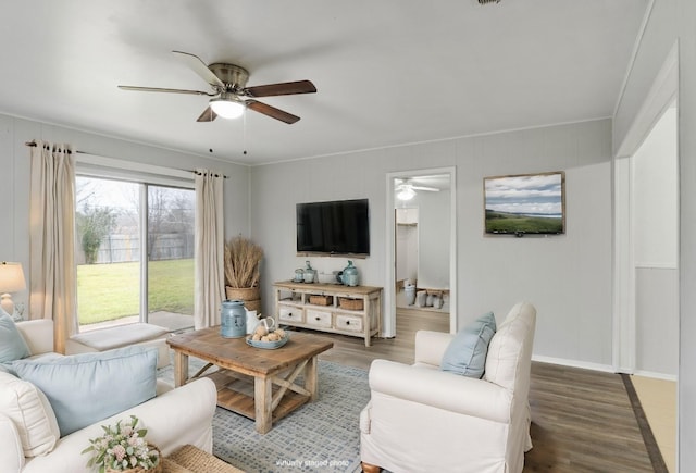 living room featuring crown molding and dark hardwood / wood-style floors