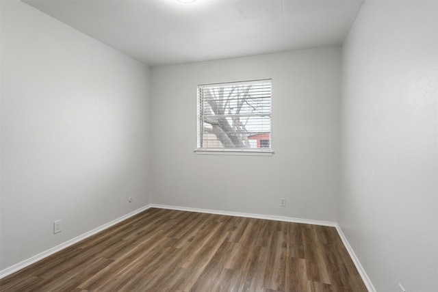 spare room featuring dark hardwood / wood-style floors