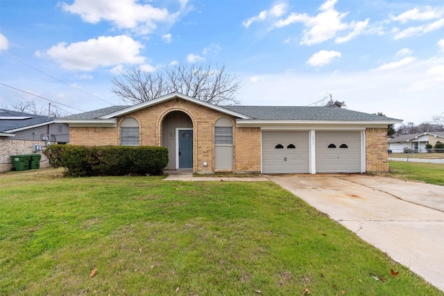 ranch-style house featuring a front lawn and a garage