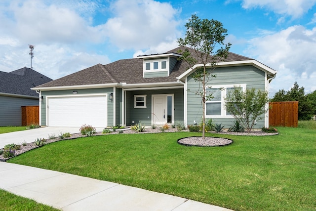 view of front of property with a garage and a front yard