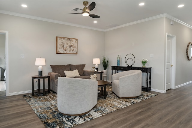 living room with crown molding, dark wood-type flooring, and ceiling fan