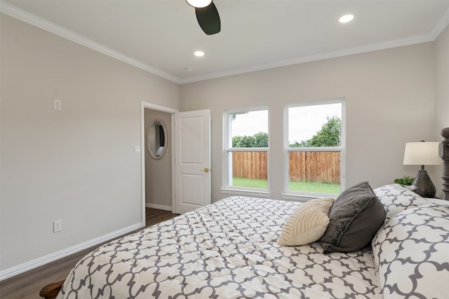 bedroom with ornamental molding, ceiling fan, and dark hardwood / wood-style floors